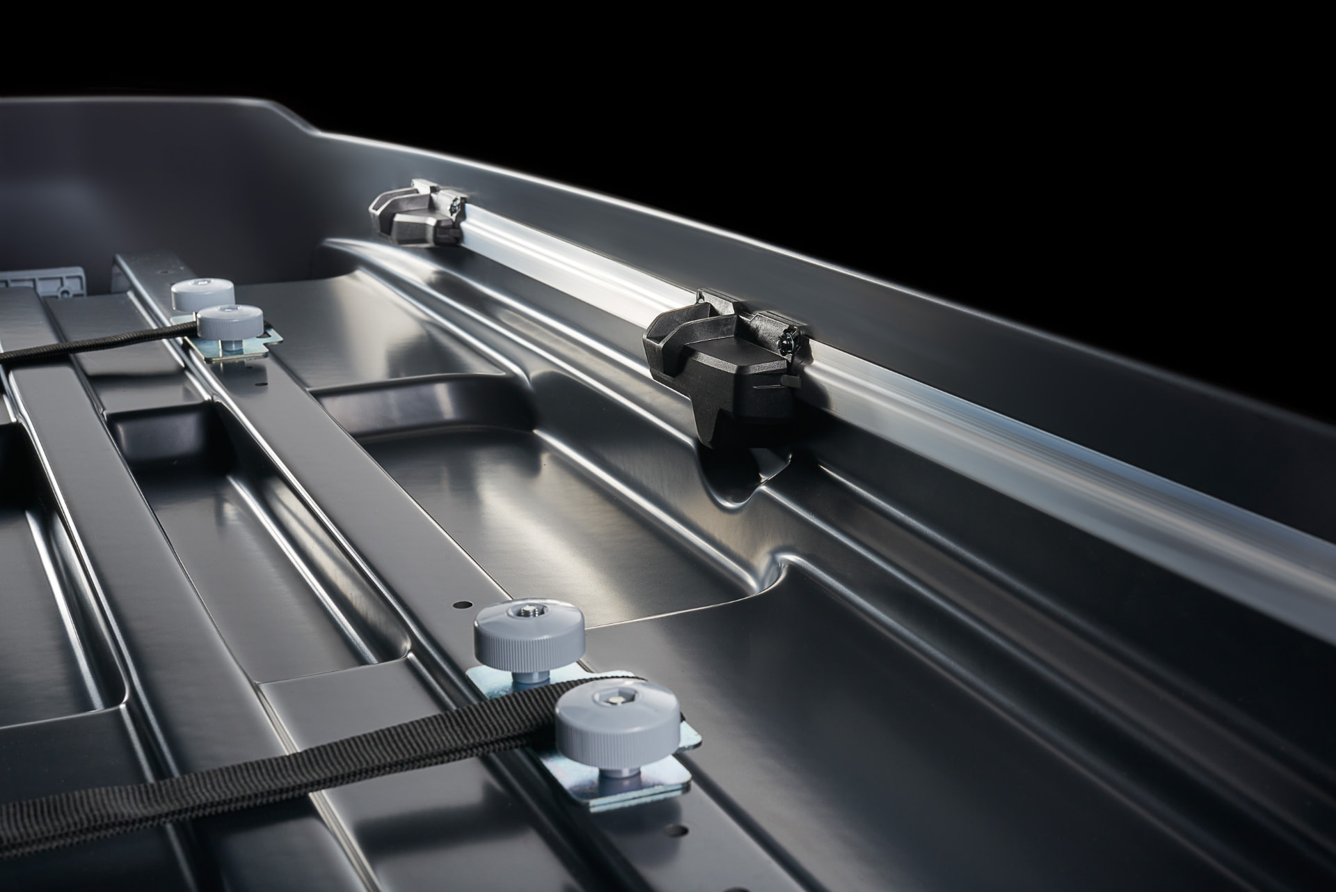Interior fixing rail with clamps and load strap
